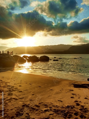 por do sol na praia do portinho em ilhabela - sp photo