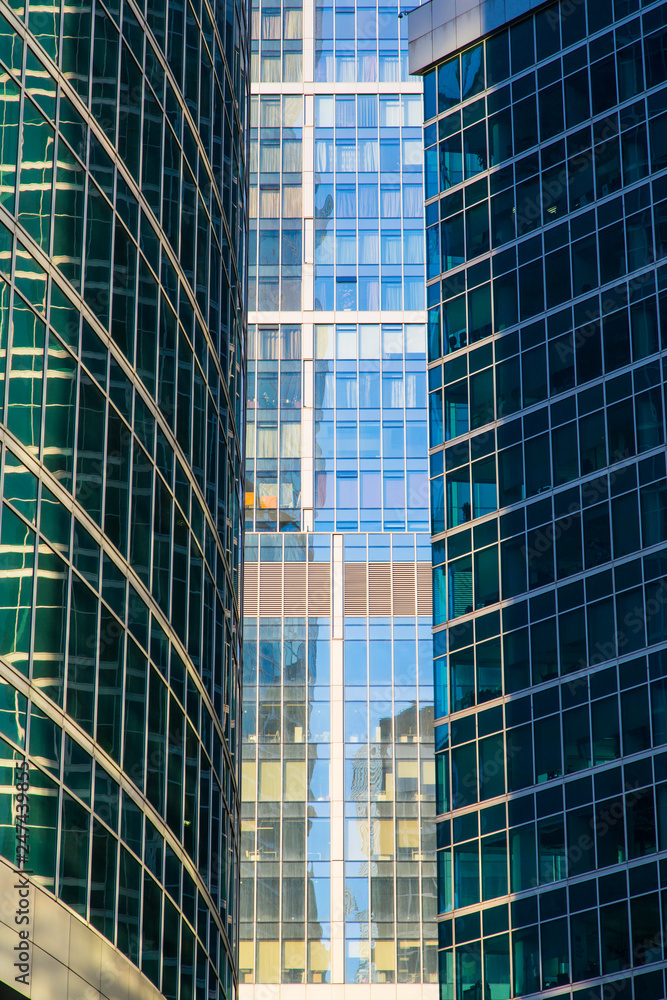 Moscow-City Mirrored skyscrapers business center. Over blue sky background. Moscow-City Mirrored skyscrapers business center. Over blue sky background.
