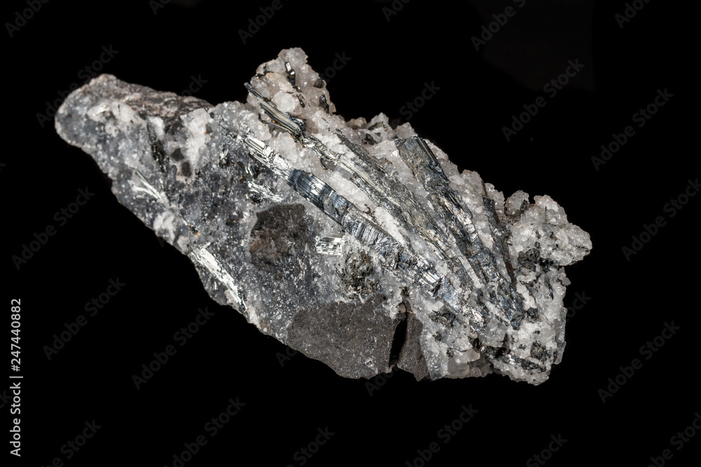 Macro mineral stone Stibnite quartz on a black background Macro mineral stone Stibnite quartz on a black background