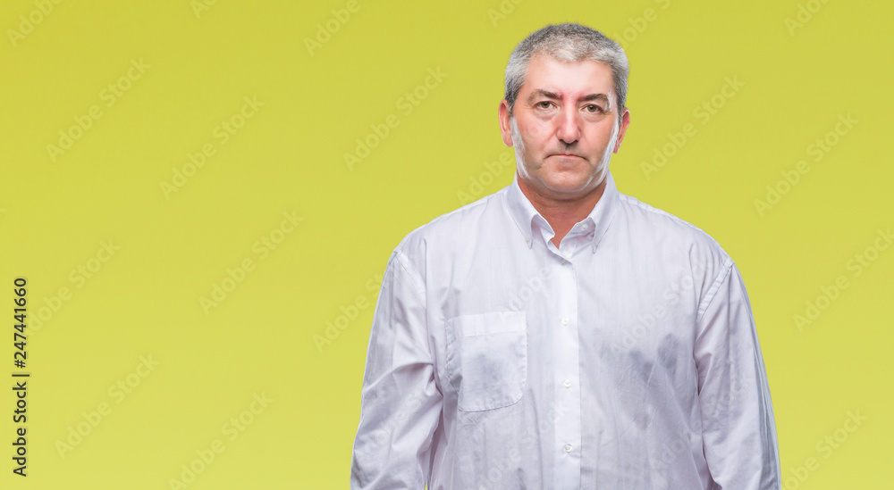 Handsome senior man over isolated background with serious expression on face. Simple and natural looking at the camera. Handsome senior man over isolated background with serious expression on face. Simple and natural looking at the camera.