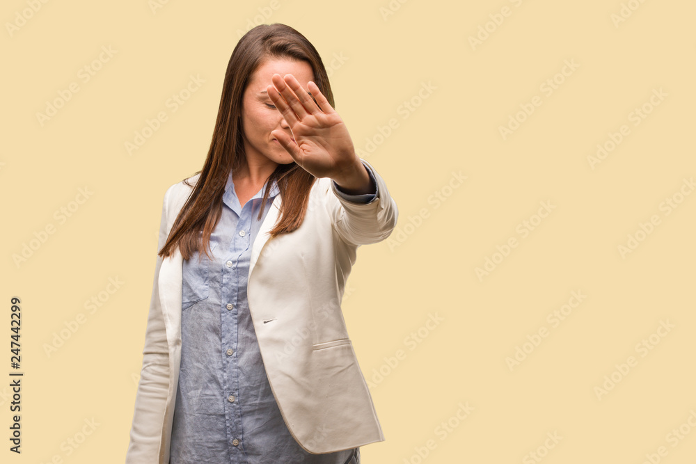 Caucasian business young woman putting hand in front Caucasian business young woman putting hand in front