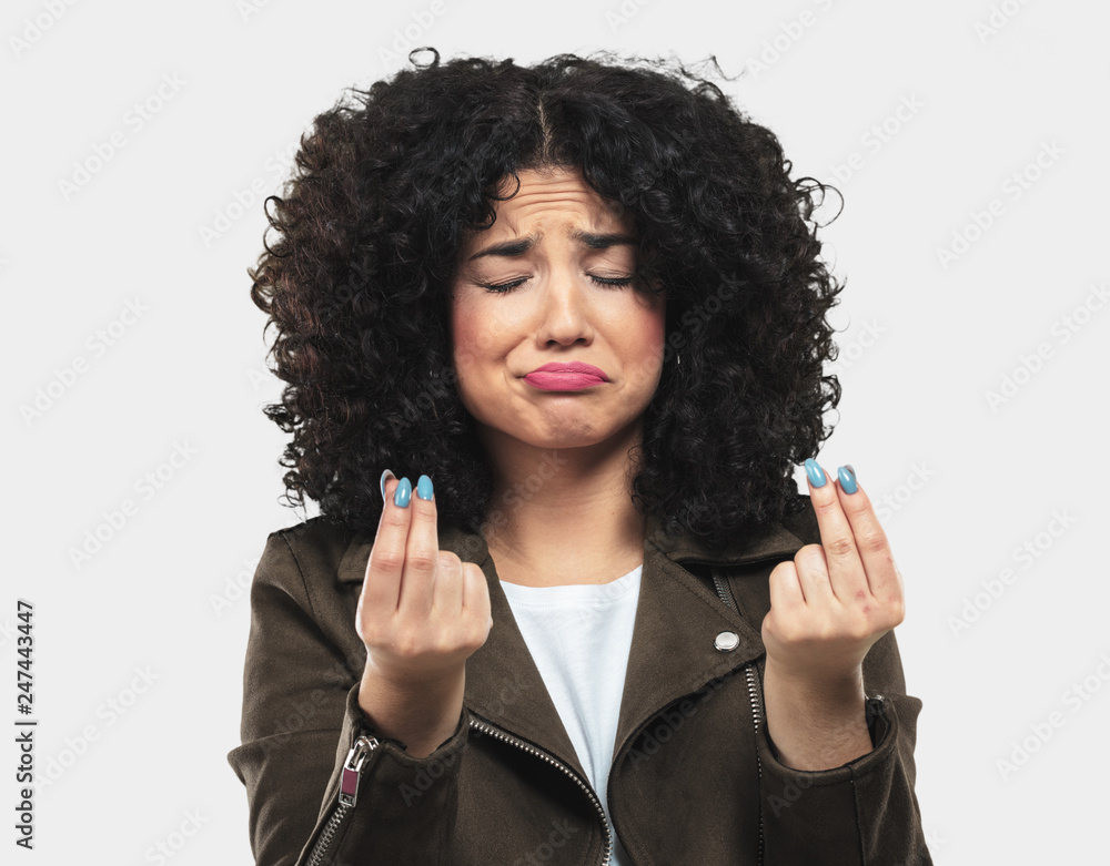 young woman doing poor gesture young woman doing poor gesture