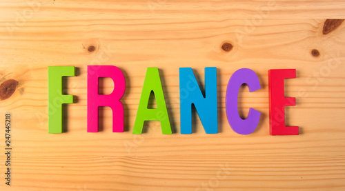 Word France on wooden background