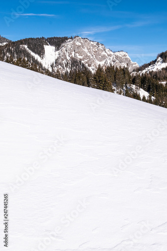 Snow covered slope in holiday-resort Hohentauern with mountain Sunkmauer photo