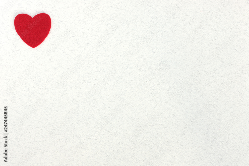 red felt hearts on white paper background with space for text