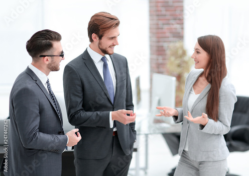 Young business woman introduces herself to client.