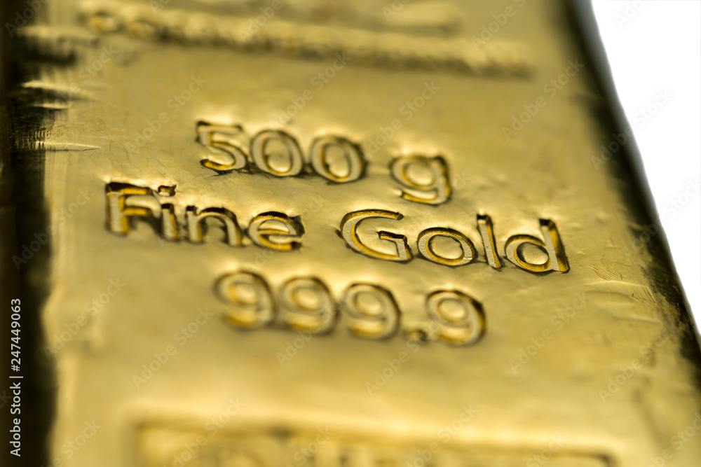 The surface of cast gold bar weighing 500 grams. The texture of the surface of the gold bar. Selective focus. (shallow DOF) The surface of cast gold bar weighing 500 grams. The texture of the surface of the gold bar. Selective focus. (shallow DOF)