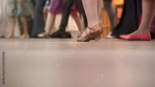 People dancing together at a dancing class party, learning to dance folk and ballroom dances.