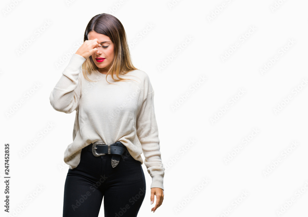 Young beautiful woman casual white sweater over isolated background tired rubbing nose and eyes feeling fatigue and headache. Stress and frustration concept. Young beautiful woman casual white sweater over isolated background tired rubbing nose and eyes feeling fatigue and headache. Stress and frustration concept.