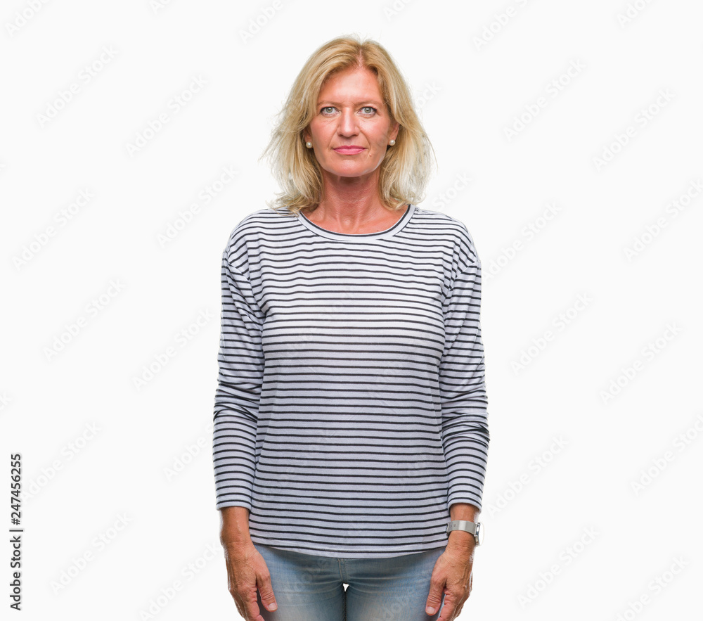 Middle age blonde woman over isolated background with serious expression on face. Simple and natural looking at the camera. Middle age blonde woman over isolated background with serious expression on face. Simple and natural looking at the camera.