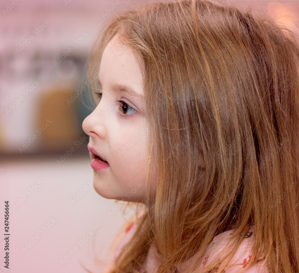 Portrait of young beautiful little girl, side view Portrait of young beautiful little girl, side view