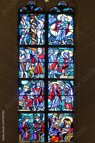 Stained glass window in Basilica of St. Vitus in Ellwangen, Germany  photo