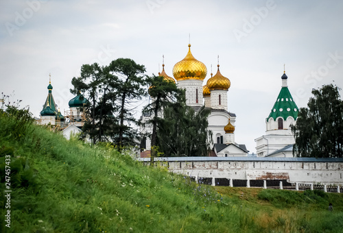 Ipativsky monastery - beautiful old architecture of russian orthodoxy church. Russia, town Kostroma. Summer, green trees