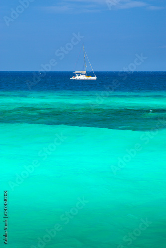 alone catamaran in lagoon in sunny day in Zanzibar in Tanzania
