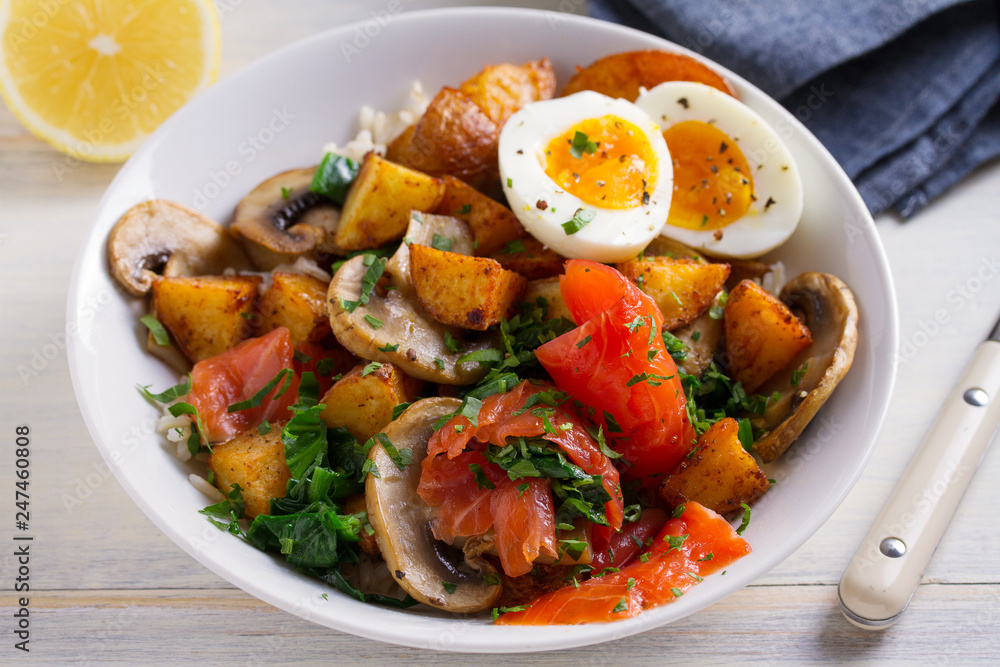 Healthy food bowl: salmon, eggs, potatoes, mushrooms, rice and spinach on white wooden table. horizontal Healthy food bowl: salmon, eggs, potatoes, mushrooms, rice and spinach on white wooden table. horizontal