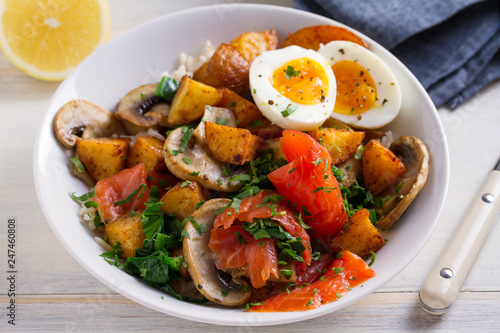 Healthy food bowl: salmon, eggs, potatoes, mushrooms, rice and spinach on white wooden table. horizontal