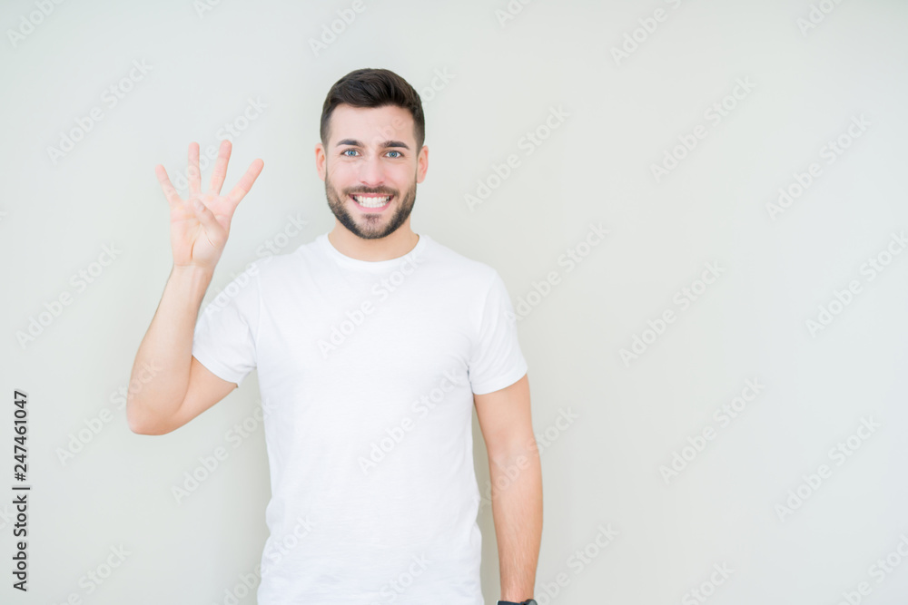 Young handsome man wearing casual white t-shirt over isolated background showing and pointing up with fingers number four while smiling confident and happy. Young handsome man wearing casual white t-shirt over isolated background showing and pointing up with fingers number four while smiling confident and happy.