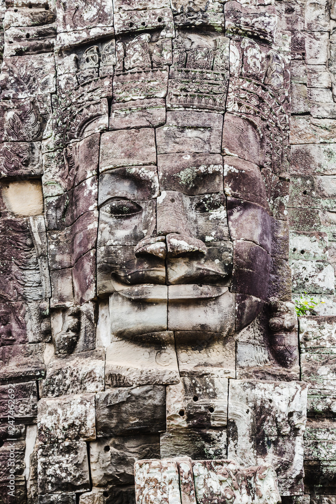 Giant faces of Bayon at Siem Reap Park in Cambodia