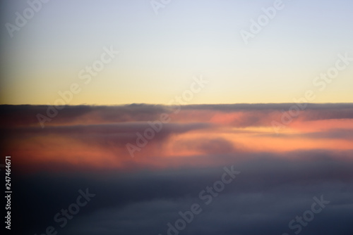 The blue skyline with cloudy in sunrise time, view from window on the plane. © Joeahead