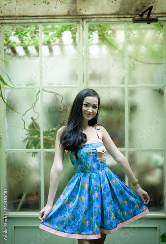 Asian pretty girl has relaxing with happy and smiling at Little Tree Garden cafe, Nakhon Pathom province, Thailand in the morning.