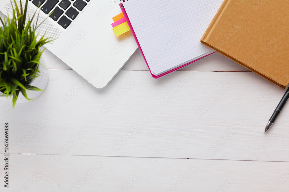 top view image of open notebook with blank pages on wooden table. ready for adding text or mockup. top view image of open notebook with blank pages on wooden table. ready for adding text or mockup.