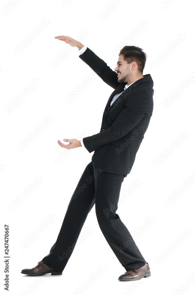 Young businessman with magnet attracting people on white background Young businessman with magnet attracting people on white background