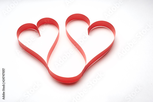 Red heart ribbon on white background