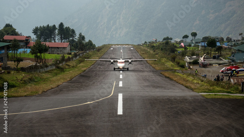 The plane landing at Lukla airport - one of the most dangerous airport in the world photo