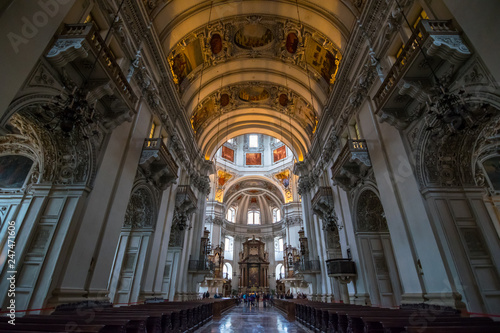 Salzburg, Austria - October, 07, 2018 - Tourists visit the interior of the Salzburg Cathedral. © Nido Huebl