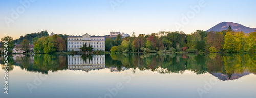 Beautiful sunset colors in Leopoldskroner Weiher Lake with Leopoldskron Palace and Hohensalzburg Fortress in the background - Salzburg, Austria © Nido Huebl
