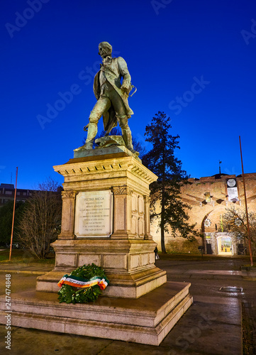 Monument to Pietro Micca with the Mastio della Cittadella in the background at Giardino Andrea Guglielminetti Garden. Turin, Piedmont, Italy. photo