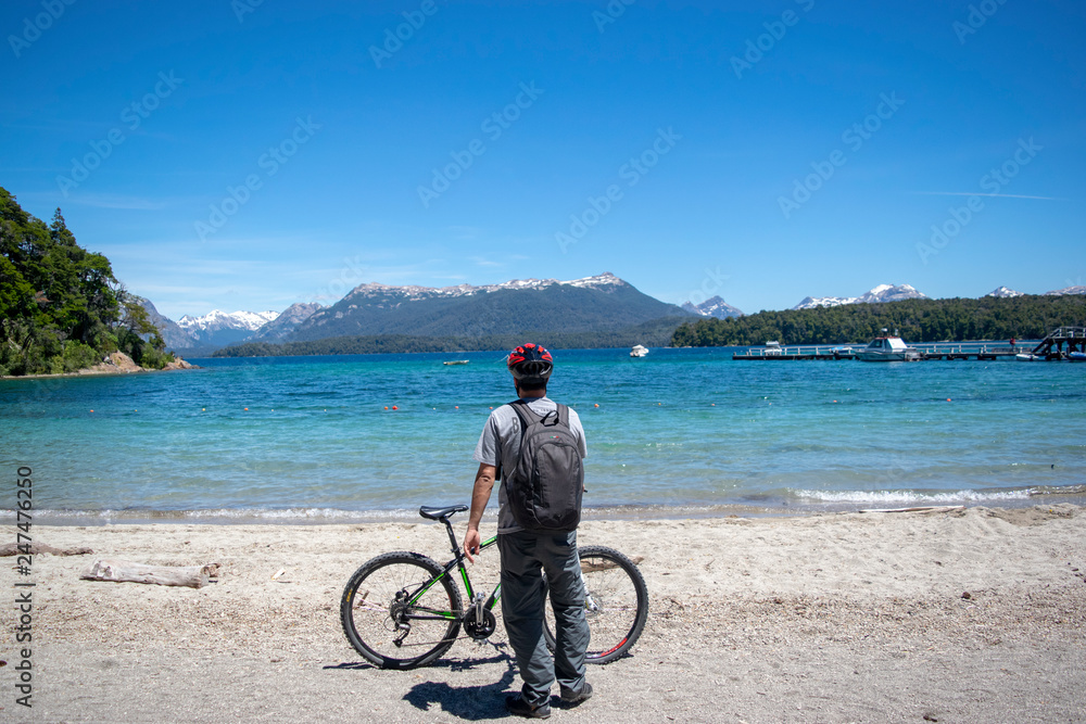 Fototapeta premium young cyclist looking at the sea