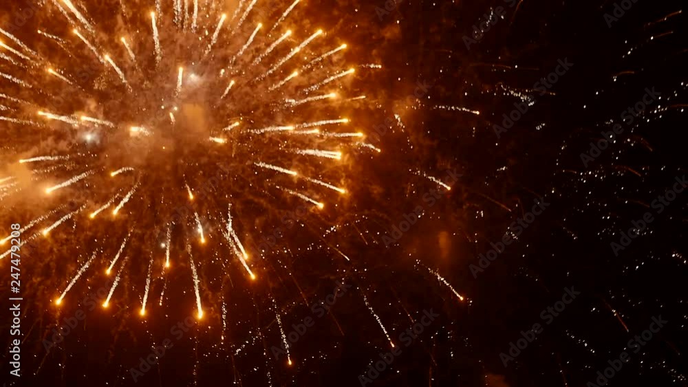 Bright volleys of fireworks in the night sky. City holiday Bright volleys of fireworks in the night sky. City holiday