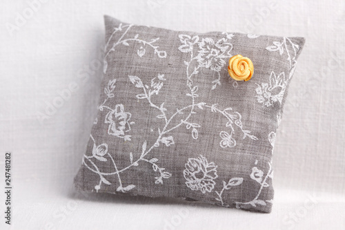 Cushion with yellow rose