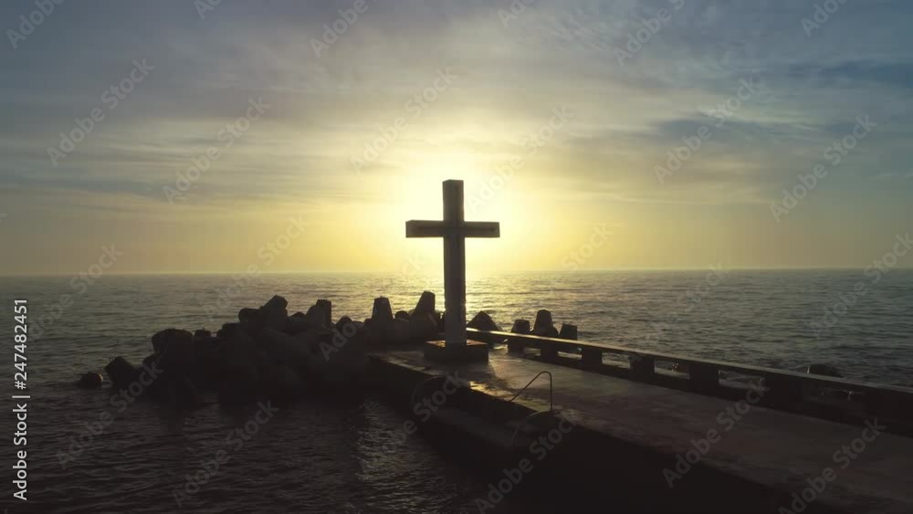 Sea sunrise. Cross and bridge in the ocean. Aerial drone video. Sea sunrise. Cross and bridge in the ocean. Aerial drone video.