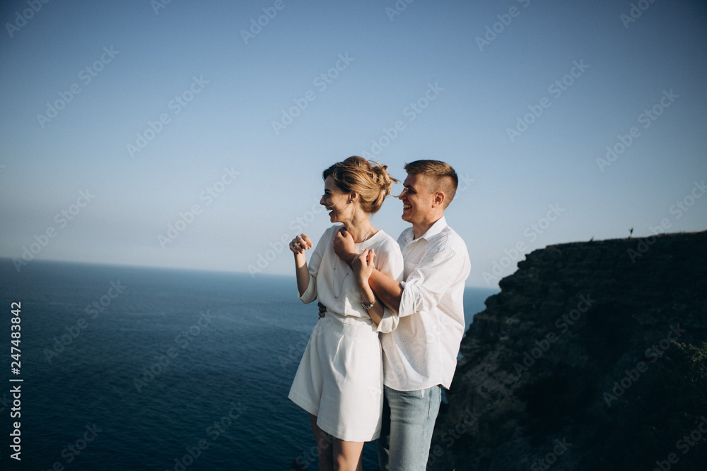 Beautiful couple on sunset photoshoot