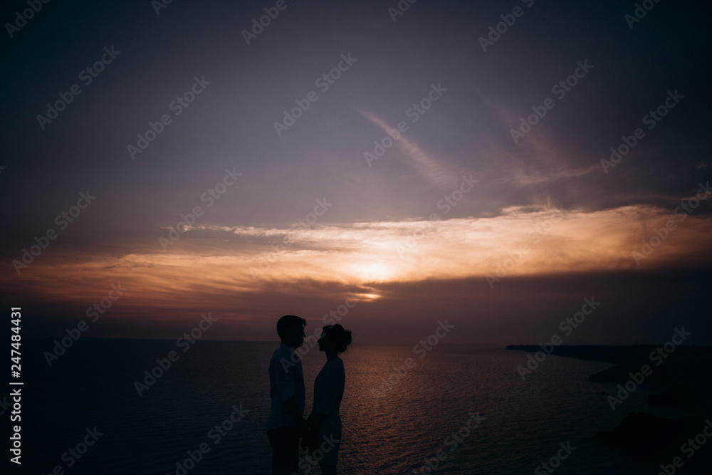 Beautiful couple on sunset photoshoot