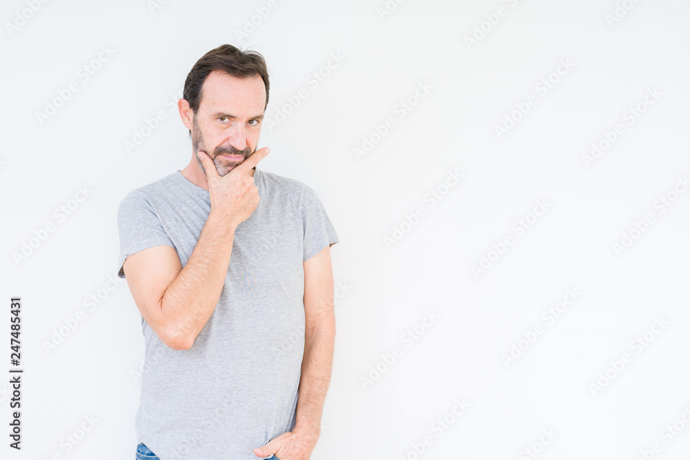 Handsome senior man over isolated background looking confident at the camera with smile with crossed arms and hand raised on chin. Thinking positive. Handsome senior man over isolated background looking confident at the camera with smile with crossed arms and hand raised on chin. Thinking positive.