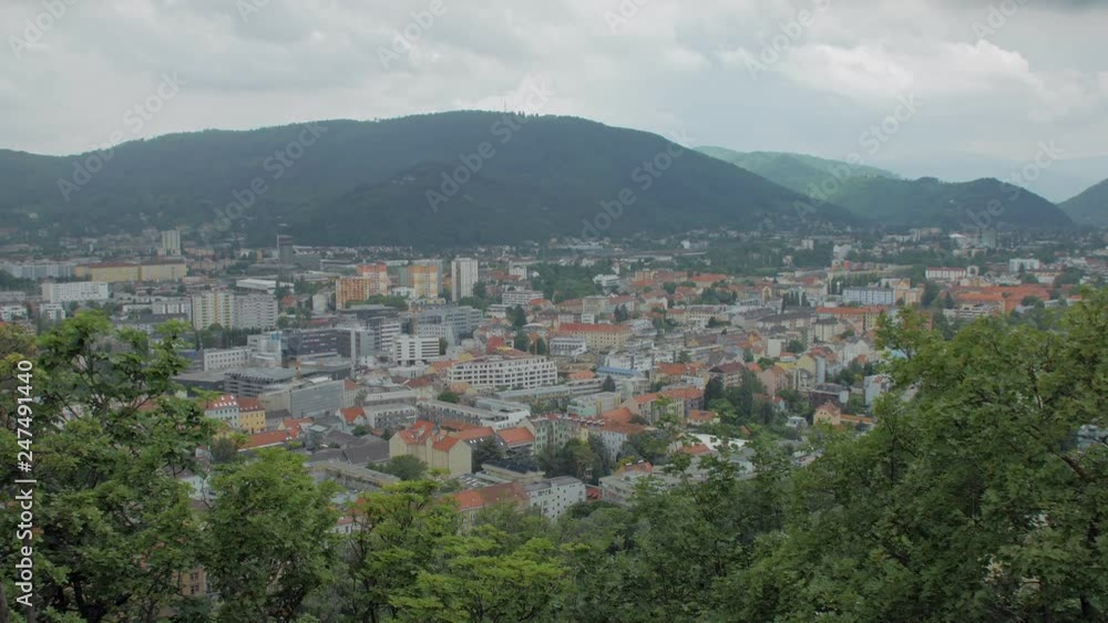 top view on small austrian town in mountains in cloudy weather top view on small austrian town in mountains in cloudy weather