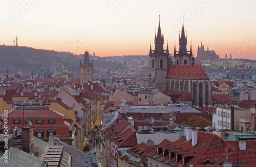 Prague - The City with the Church of Our Lady before Týn and Castle with the Cathedral in the background at dusk.