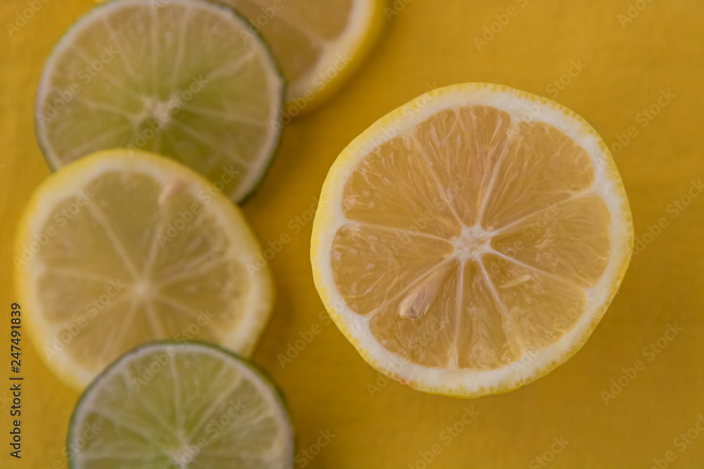 A Display of Freshly Sliced Fruit on a Yellow Surface A Display of Freshly Sliced Fruit on a Yellow Surface