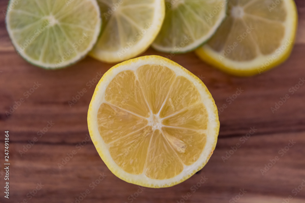 A Display of Freshly Sliced Fruit on a Wood Surface A Display of Freshly Sliced Fruit on a Wood Surface
