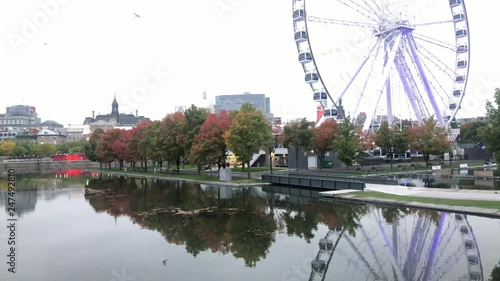 Twilight view of the beautiful fall color with the La Grande Roue de Montreal observation ferris wheel