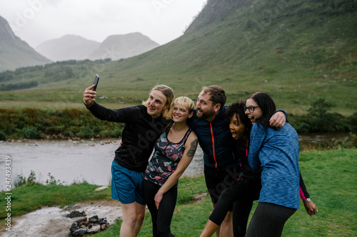 Group of athletes taking a selfie in the nature