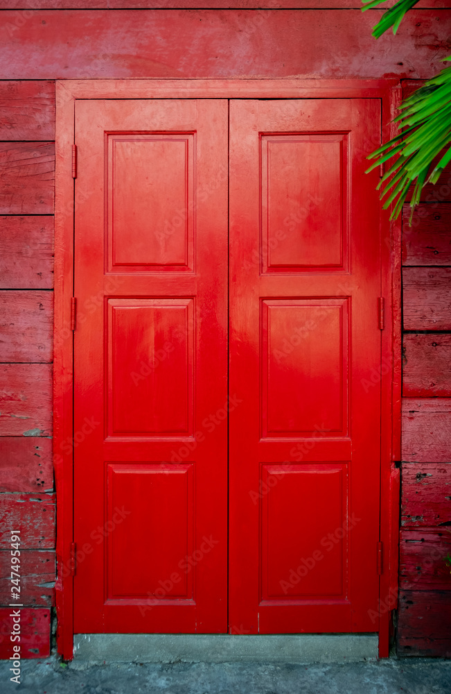 Old red typical vintage wooden door
