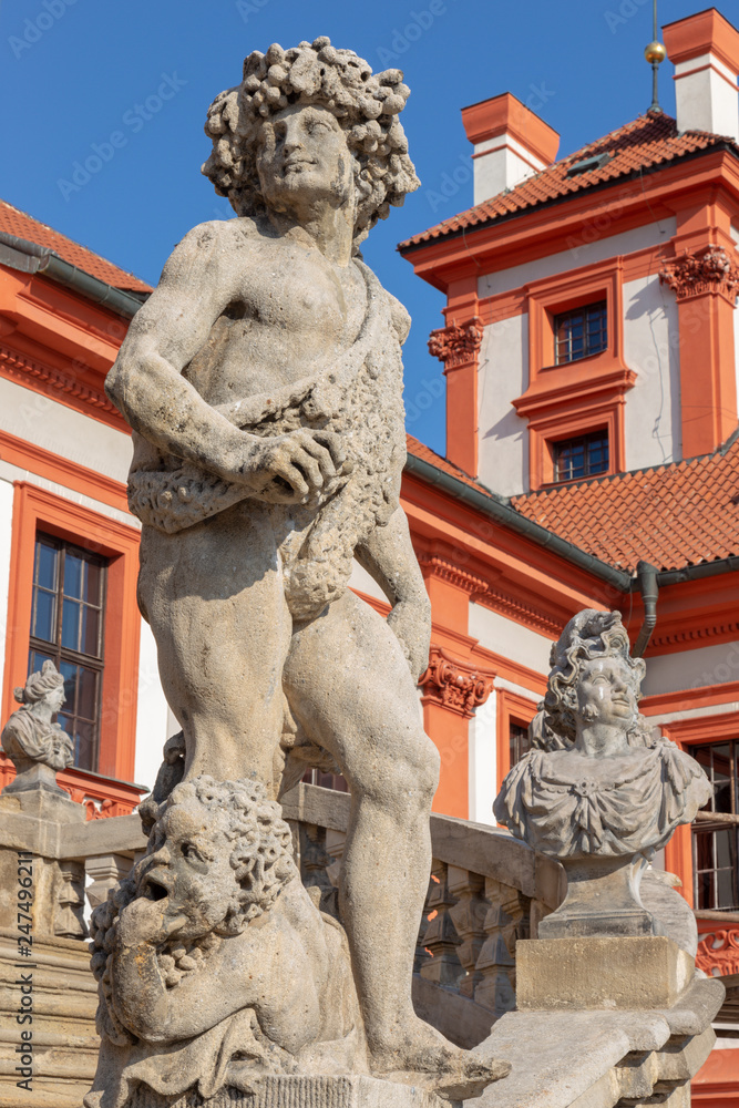 PRAGUE, CZECH REPUBLIC - OCTOBER 16, 2018: The statue of Dionysus on the stairs of baroque palace Trojsky zámek by  Georg a Paul Heermann (1685).