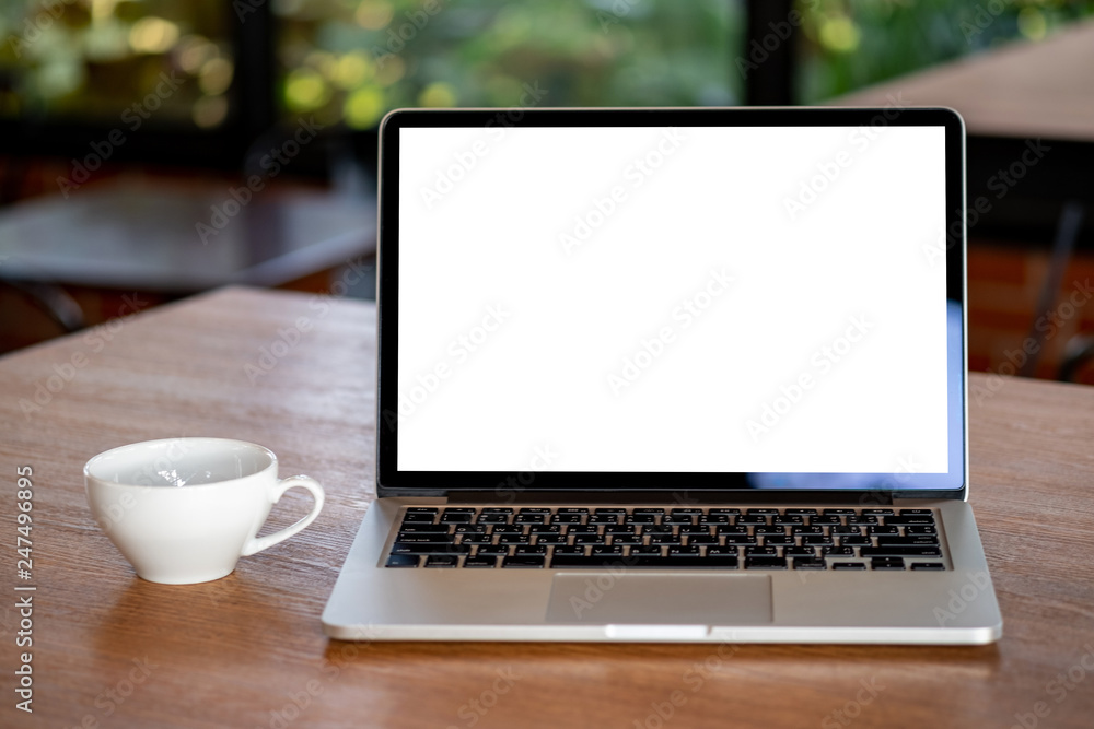 mock up Using laptop with blank screen computer modern Workspace in coffee shop