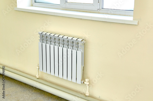 Wallpaper Mural Heating white radiator under a large window. Torontodigital.ca