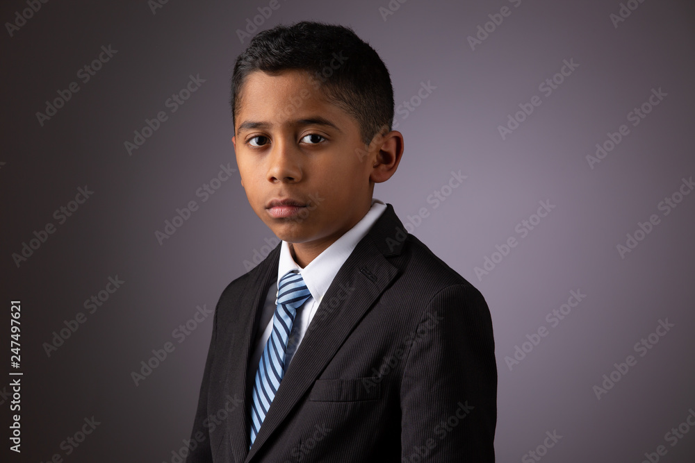 Portrait of Hispanic Young Boy Looking Confidently Straight to the Camera Portrait of Hispanic Young Boy Looking Confidently Straight to the Camera