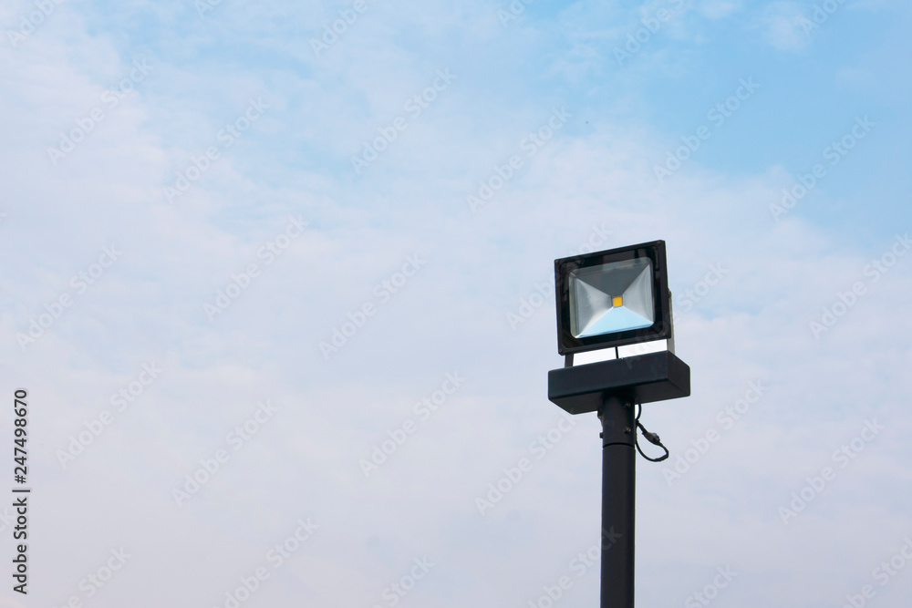 Spotlight pole stand upright against sky Spotlight pole stand upright against sky